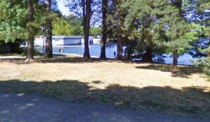 small field surrounded by trees near the Green Lake stadium steps